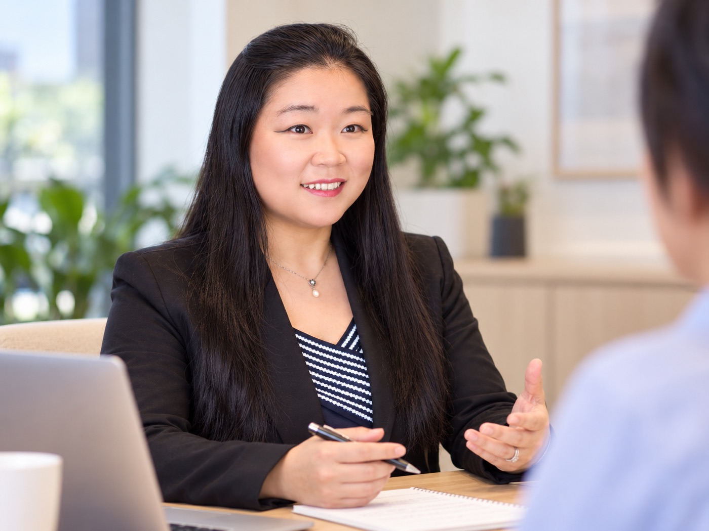 Maybell Sun talking through a client's numbers